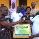 Dr Gabriel Ofoe Canacoo (right) chairman of Webb of Excellence Welfare Fund, receiving the special certificate of honour from Mr Kafui Kojo Ayibor, headmaster of the Ada Senior High School, on behalf of Ms Eleanor Louise Webb, Founder of the Webb of Excellence Welfare Fund.